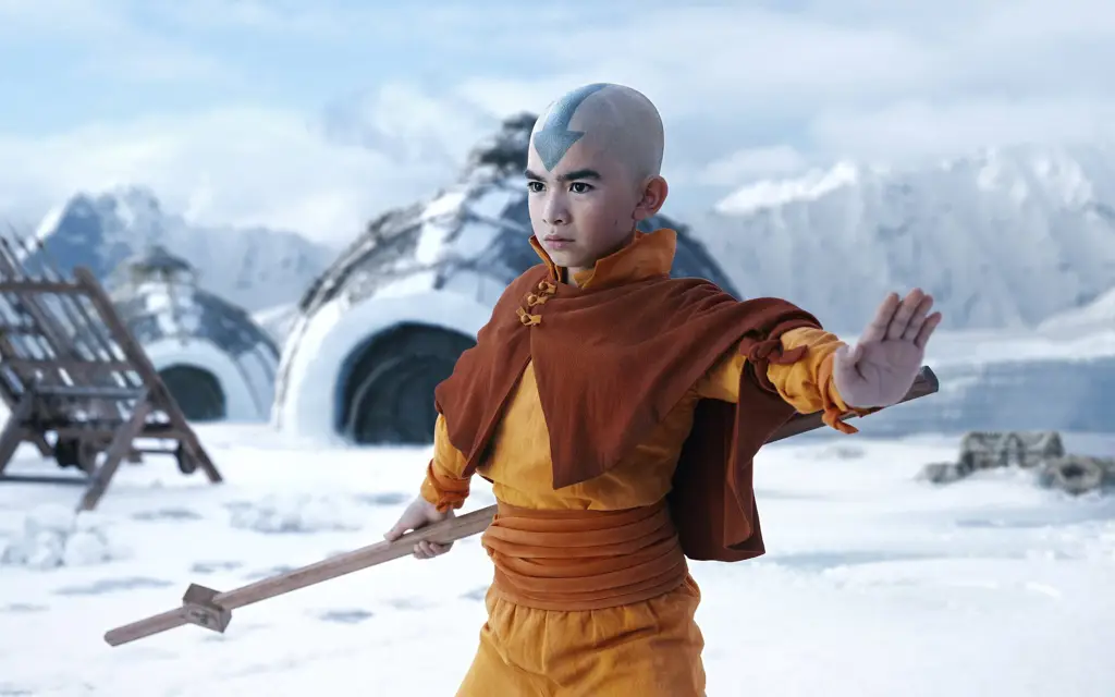 Avatar Aang sedang terbang menggunakan glidernya