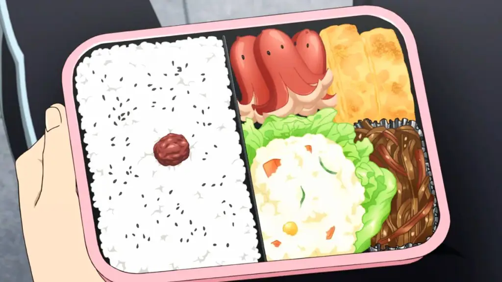 Kotak bekal dengan desain dan makanan bertema anime