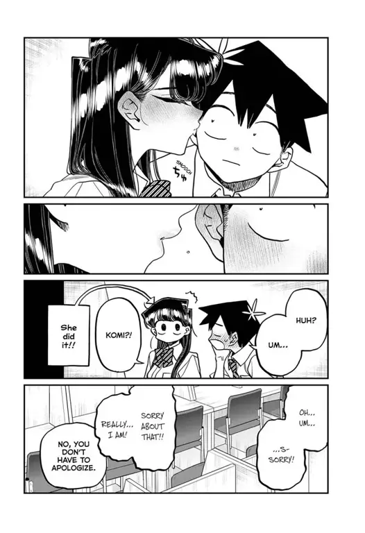 Gambar Komi-san sedang membaca manga dengan ekspresi senang