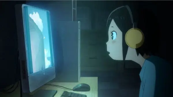 Menikmati Anime di Laptop Seseorang menonton anime di laptop