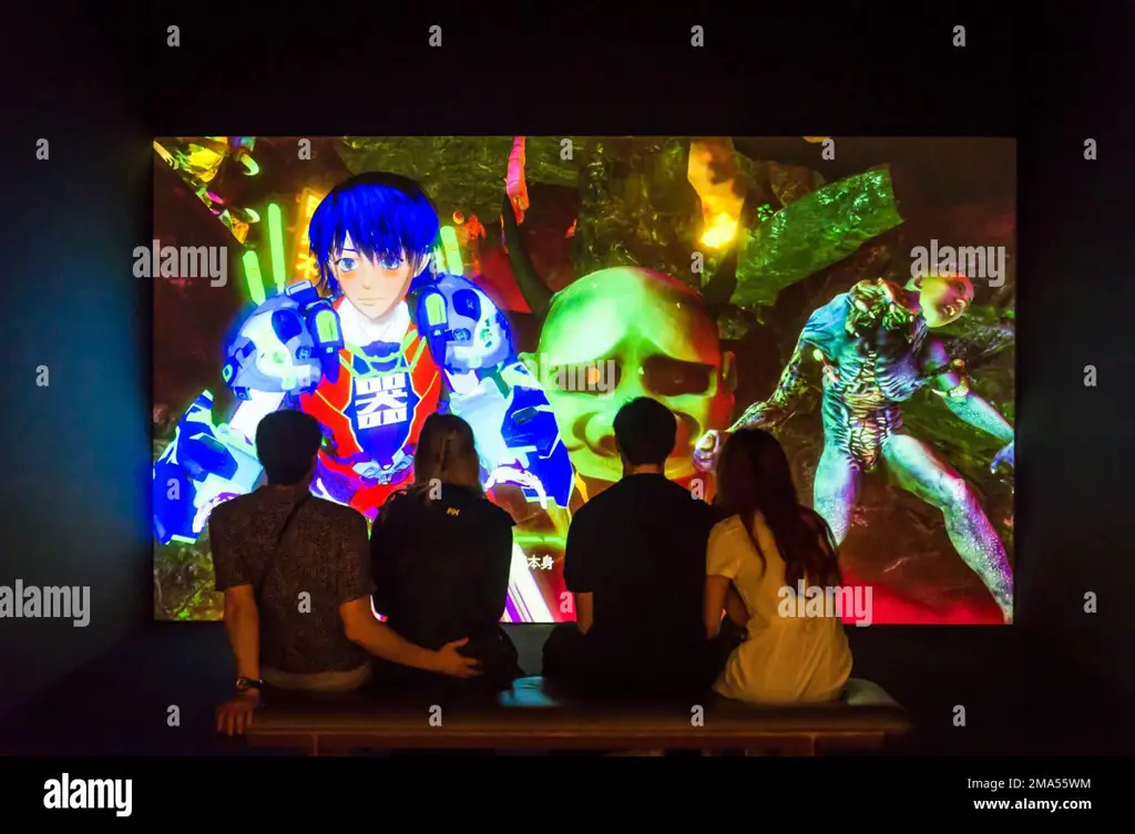 Menikmati anime di laptop Seseorang sedang menonton anime di laptopnya