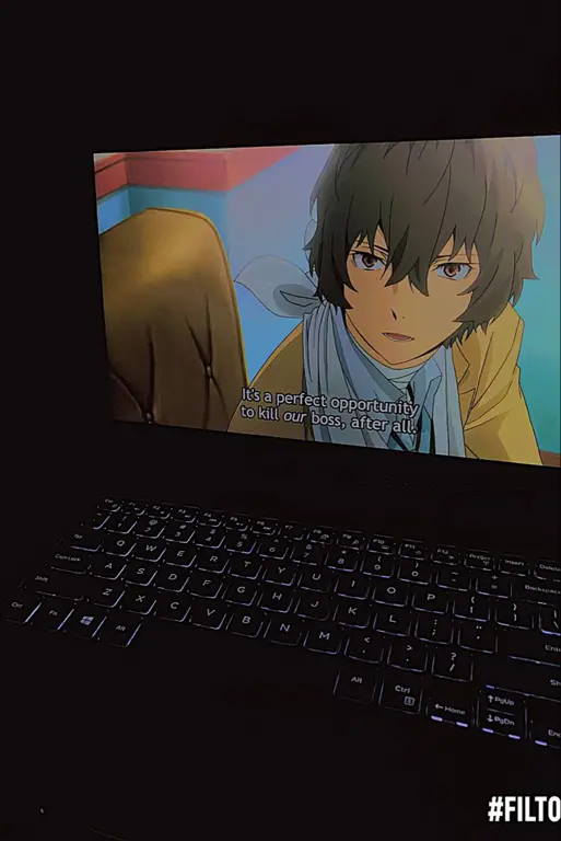 Seseorang menonton anime di laptopnya