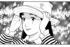 Penggemar anime sedang membaca manga di tablet dengan ekspresi bahagia