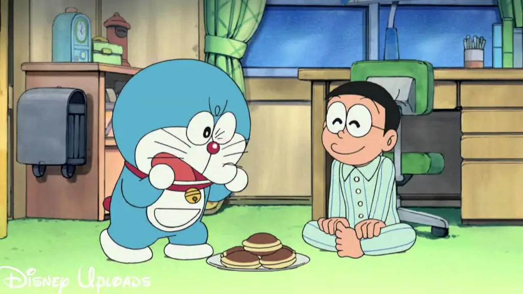 Gambar Doraemon dan teman-temannya menonton kartun bersama.