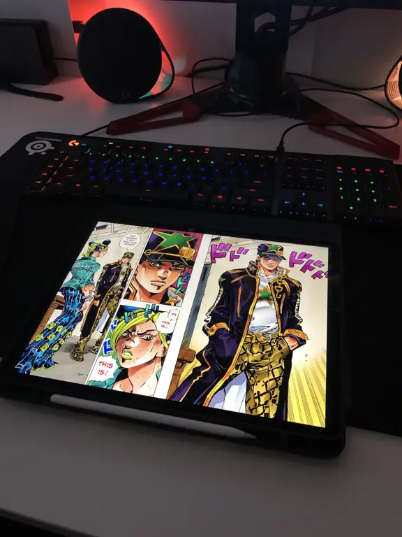 Seseorang sedang membaca manga dengan nyaman di ipad