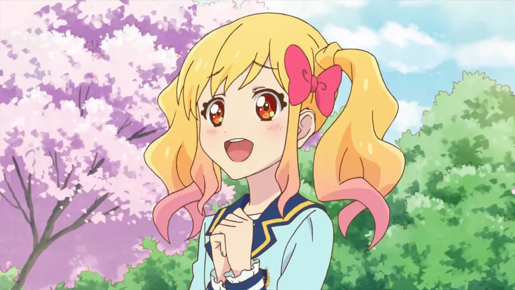 Yume Nijino, karakter utama Aikatsu Stars!, dalam kostum panggungnya yang berkilauan.